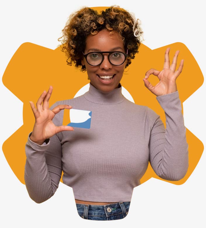 A young woman with a curly head and glasses forms the OK sign with her hand. She is happy about the CRM interfaces from awisto.