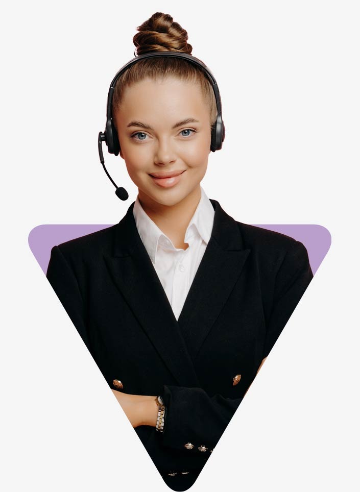A young woman in a business suit wears a headset on her head. She uses Dynamics 365 Customer Service for customer support.