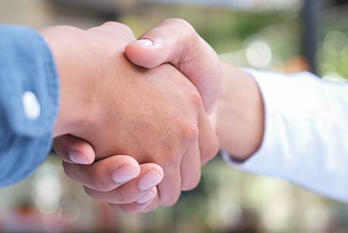 Handshake symbolizes satisfied awisto customers who use CRM industry solutions, services, add-ons or power platforms